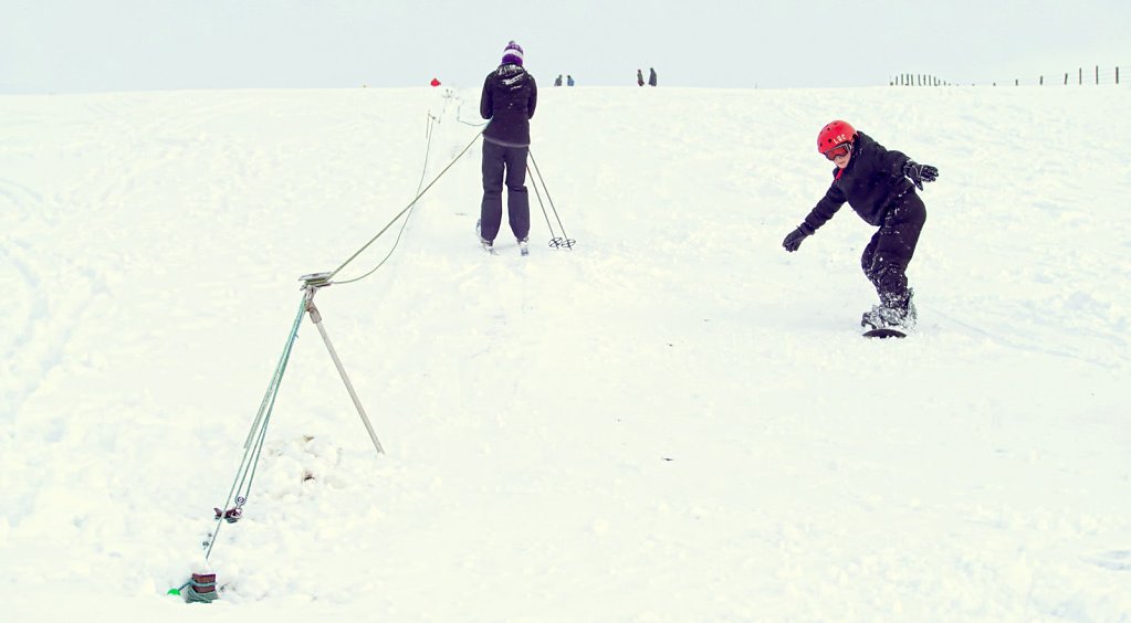 Rope tow and snow boarder